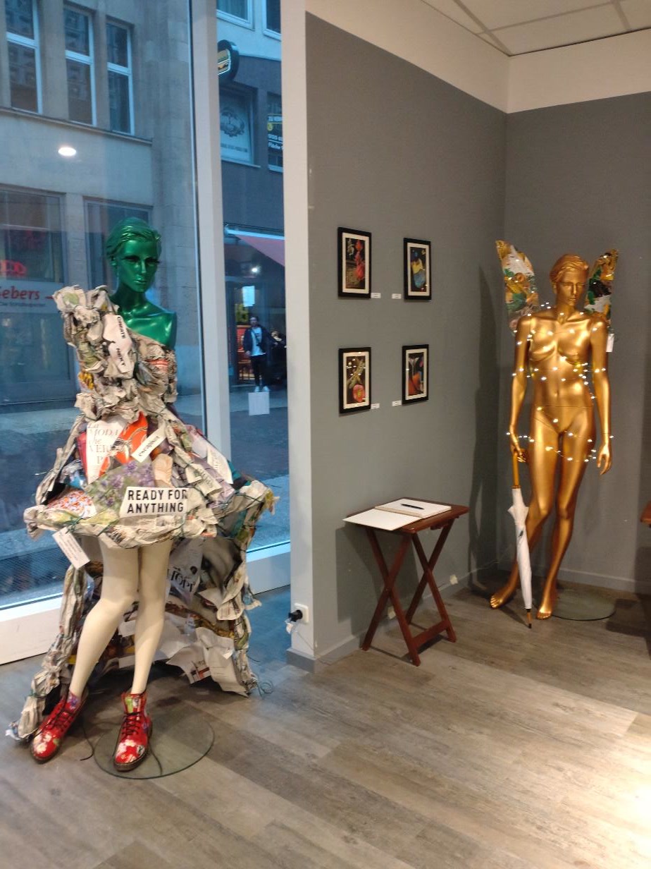 Rita Rozynek’s collage dress and collage wings shown in a Hannover exhibition.