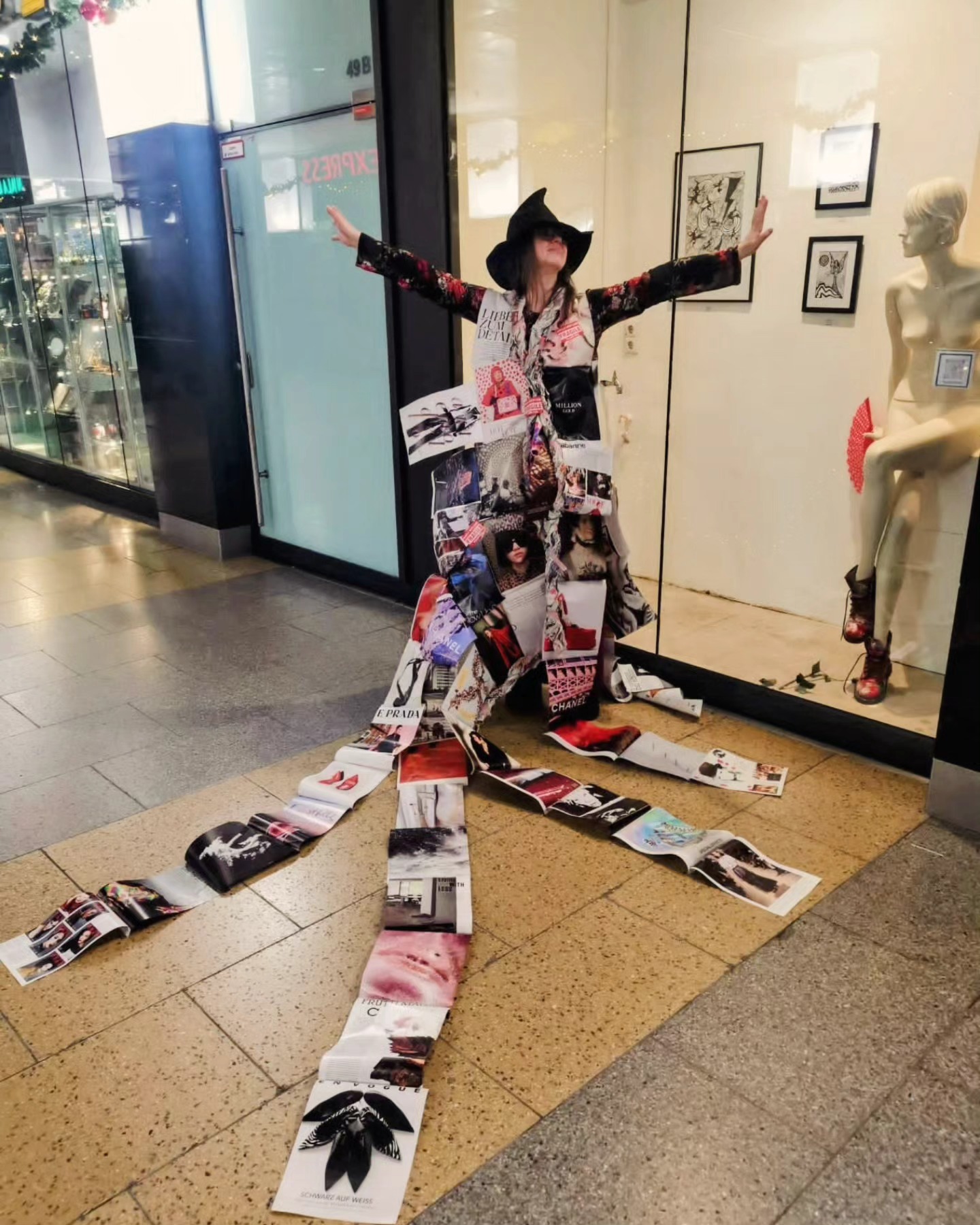 Rita Rozynek wearing a collage fashion costume at the AUSGEUFERT exhibition in Hannover.