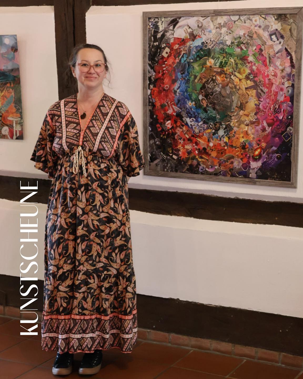 Rita Rozynek standing beside a large colourful spiral collage at the Kunstscheune Steinhude.